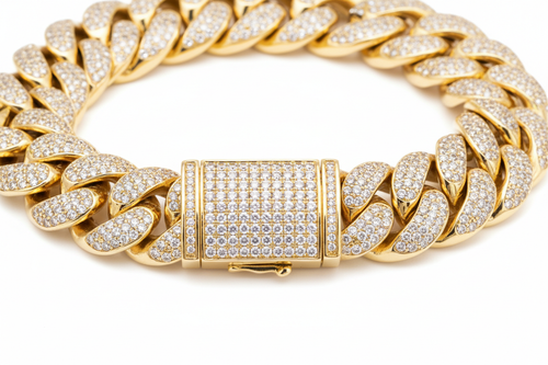 a luxury hiphop style cuban link bracelet made of polished yellow gold, thick and chunky links fully encrusted with small clear diamonds (pave setting). the bracelet feautures a rectangular box clasp in the center, also fully covered in diamonds, with visible safety latch details on the sides. High end jewelry photography realistic metal shine, sharp focus, detailed texture, studio lightning. isolated on a pure white background, no shadows, no text, no props
